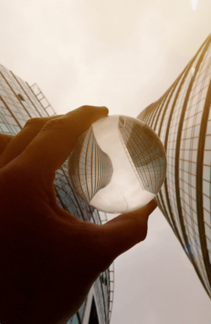 close-up-hand-holding-umbrella-against-sky